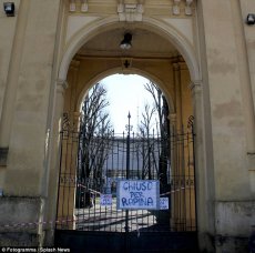 A banner on the locked gates says the Ennio Tardini stadium is now ‘Closed for robbery’