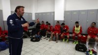 Ahli al-Khalil football club's coach, Italian Stefano Cusin talks to his players in the cloakrooms during a training session on April 24, 2015 in the West Bank town of Hebron. (photo credit: AFP PHOTO / HAZEM BADER)