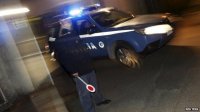 An Italian police car leaves a police station in Pianopoli village, near Catanzaro, Italy on 7 May 2015.