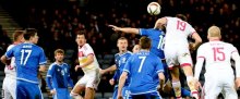 Christophe Berra (19) rises above the Northern Ireland defence to score the only goal of the game