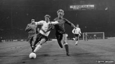 English footballer Colin Bell beats Poland's Jerzy Gorgon in 1973 match