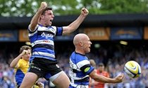 George Ford, left, celebrates his Bath team-mate Peter Stringer's try against Leicester